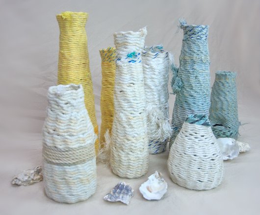 Side view, with oyster shells Reliquaries For Your Journey, Ghost Net Baskets -  artwork by Emily Miller